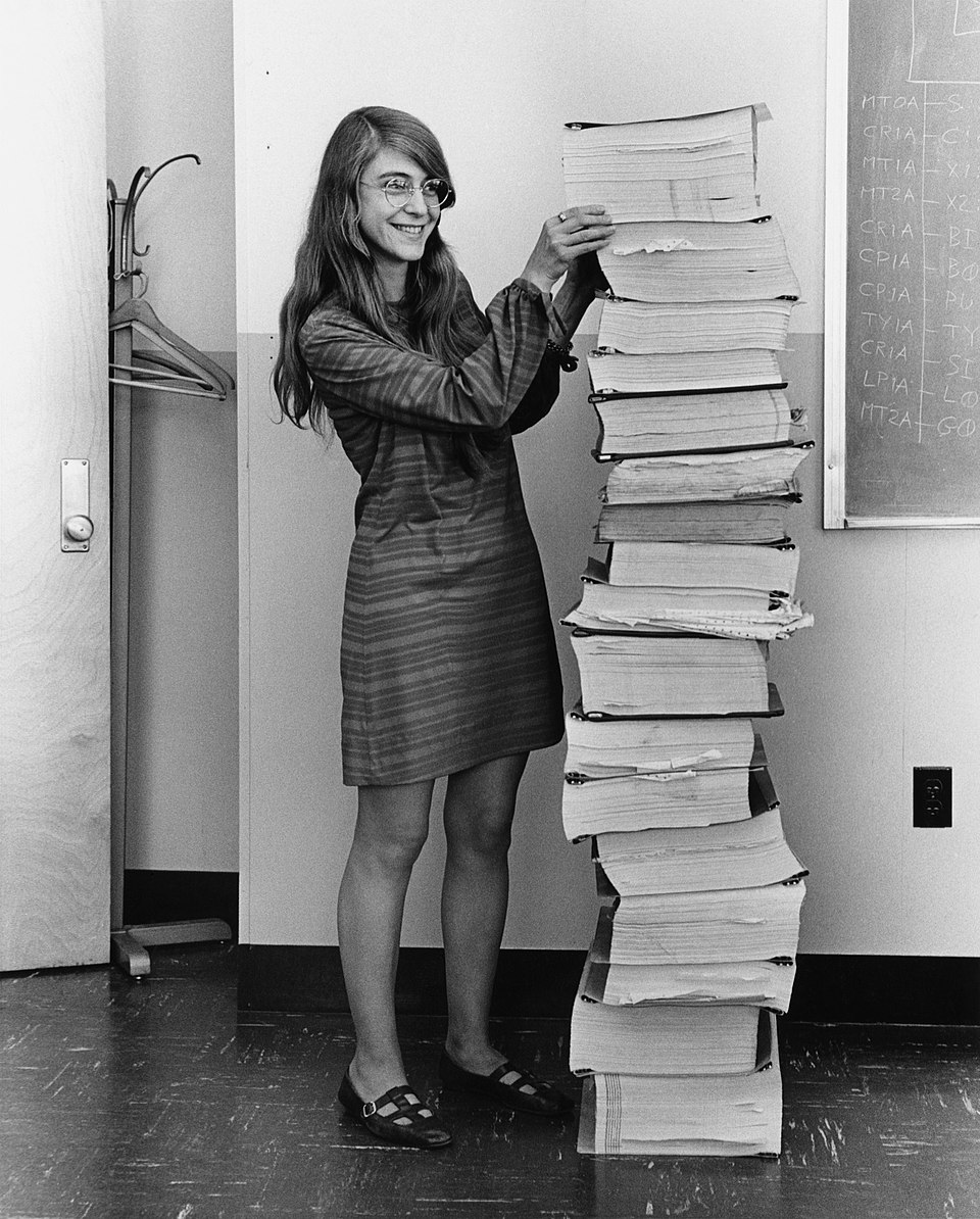Margaret Hamilton shown in 1969 standing beside listings of the software developed by her and her team for the Apollo program’s Lunar Module and Command Module.
Source: Wikimedia Commons.